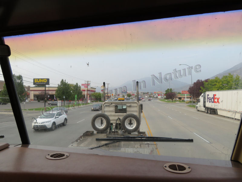 Riding on the back of a flatbed truck